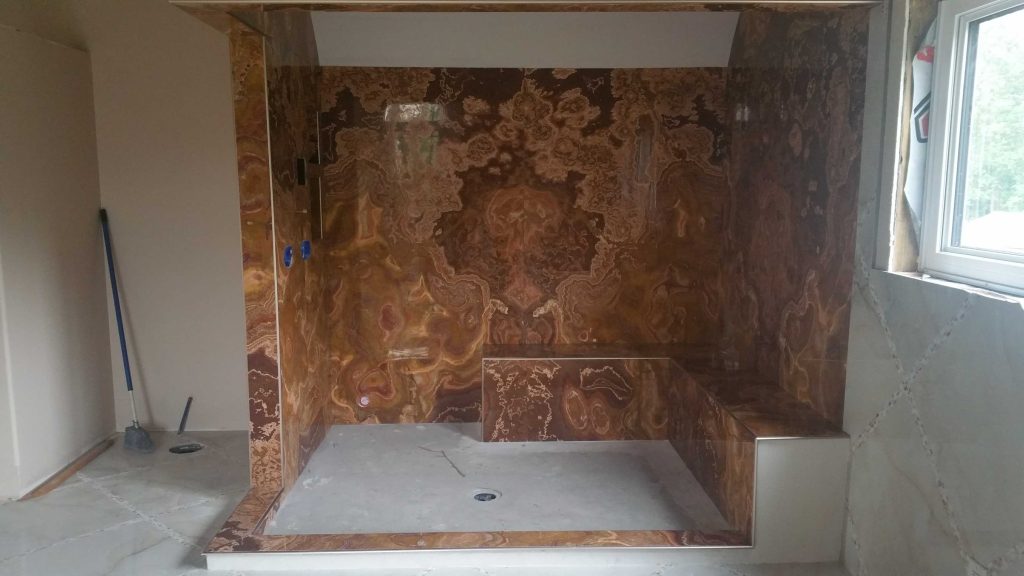 Tiger Onyx shower cave Edmonton Bathroom renovations.